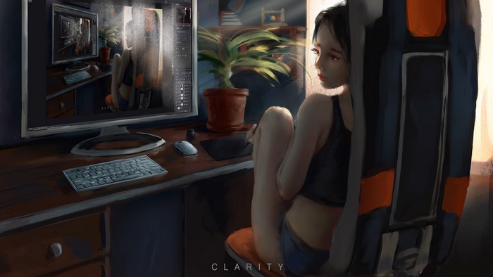 Woman sitting at a computer desk