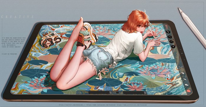 Girl drawing on a tablet with lotus flowers