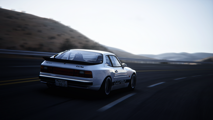 Porsche 944 Turbo driving on a road