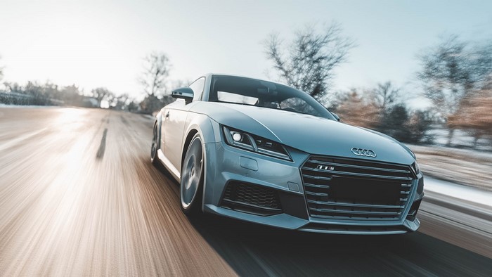 Silver Audi TT driving on a snowy road