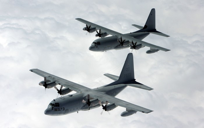 Two Lockheed C-130 Hercules aircraft in flight