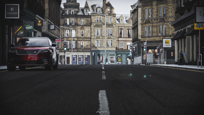 Red Range Rover Velar on a city street
