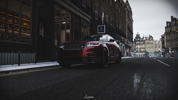 Red Range Rover Velar in a city street