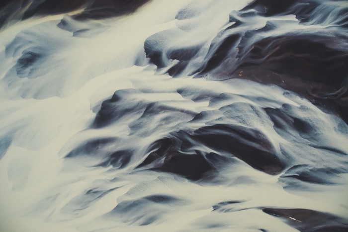 Abstract patterns of water and dark earth