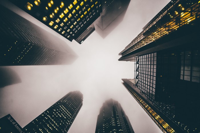 Skyscrapers in mist, worm's eye view