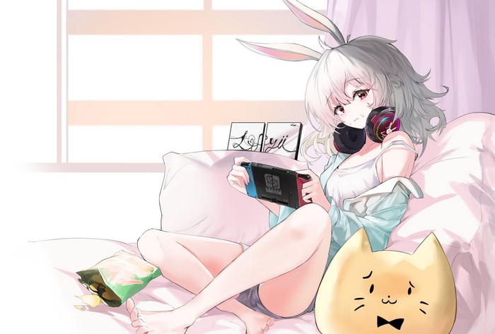 Anime bunny girl playing Nintendo Switch in bed
