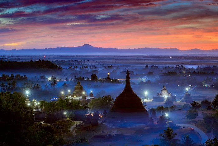 Temples in mist at sunrise in Burma