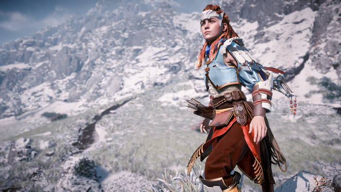 Aloy from Horizon Zero Dawn in a snowy mountain landscape