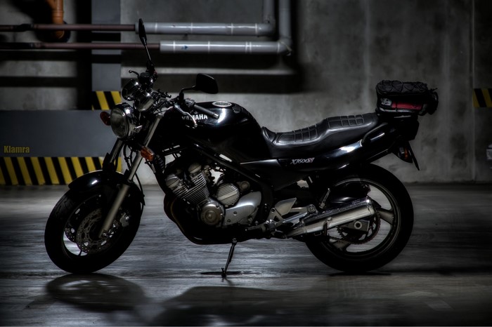 Black Yamaha XJ600N motorcycle in a parking garage