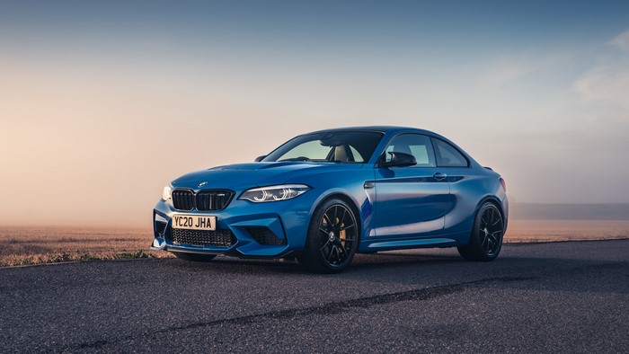 Blue BMW M2 car on a road