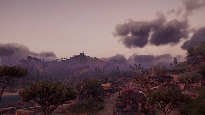 Assassin's Creed Odyssey screenshot of a village and mountains