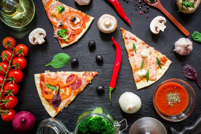 Pizza slices with ingredients and sauce