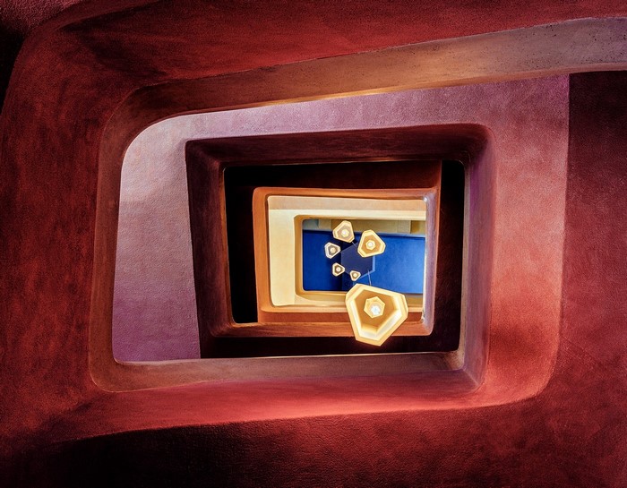 Abstract architecture with spiral staircase and lamps