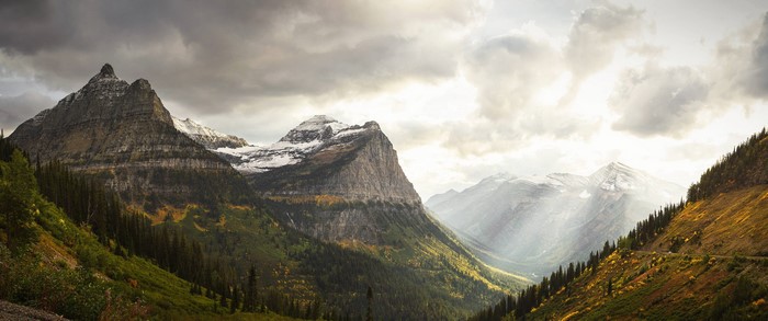 Panoramic view of mountains with sunbeams