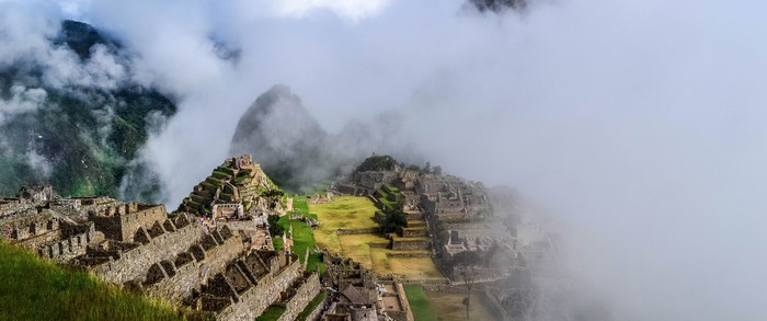 Machu Picchu ruins in Peru shrouded in mist