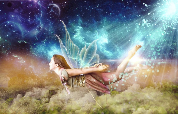 Fantasy girl with wings flying through space
