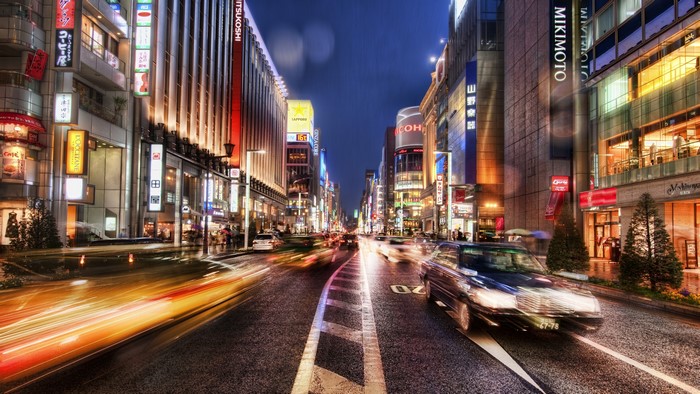 Night street in Japan with traffic and city lights