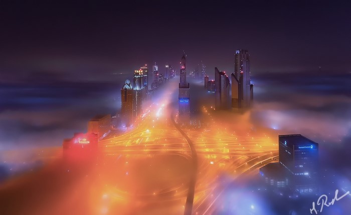 Dubai cityscape at night with fog and lights