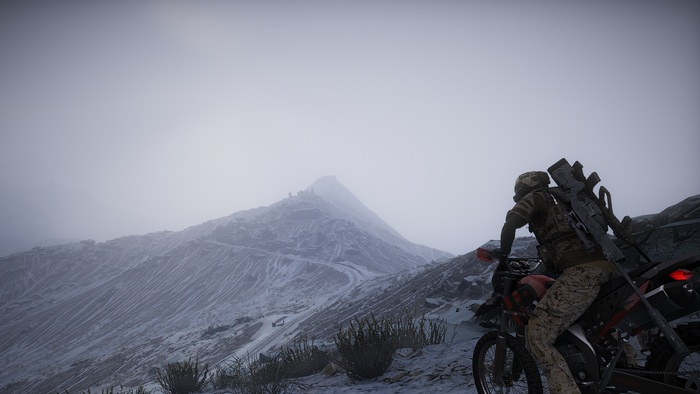 Ghost Recon Wildlands soldier on a motorcycle in snowy mountains