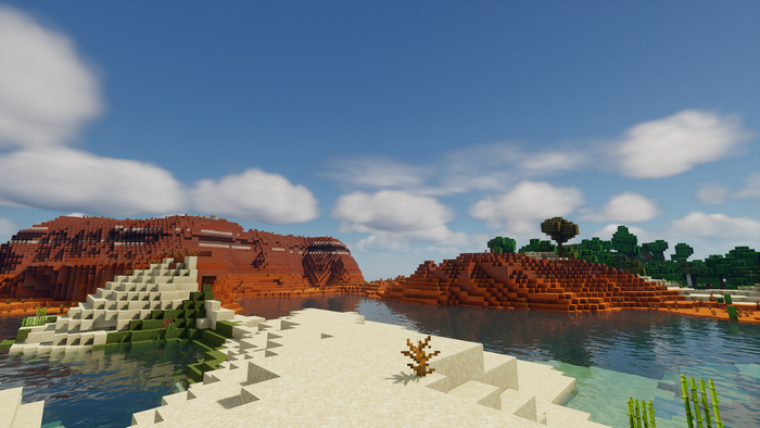 Minecraft landscape with desert hills and water