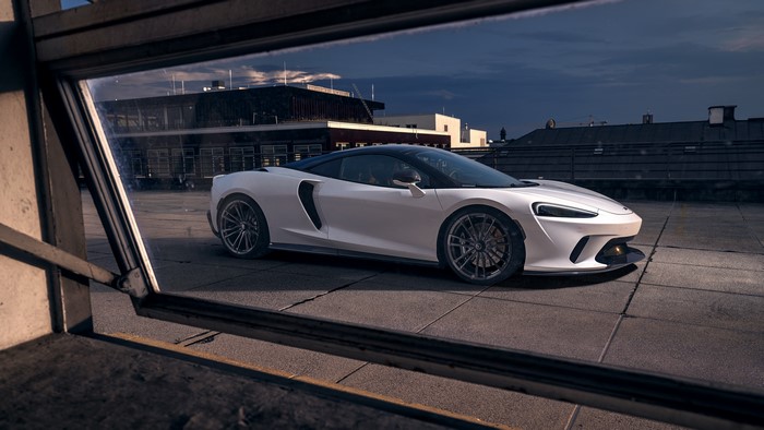 White McLaren GT on a rooftop