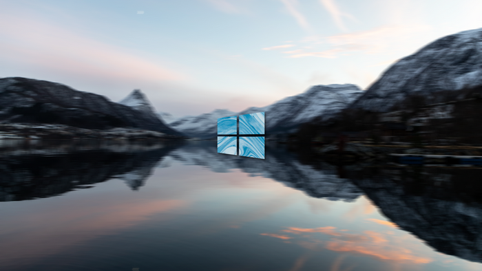 Windows 10 logo over a mountain landscape