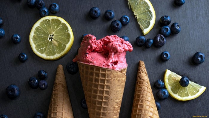 Pink ice cream cone with blueberries and lemon slices