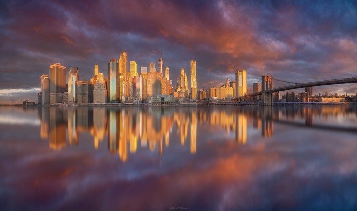 New York City skyline and Brooklyn Bridge at sunrise
