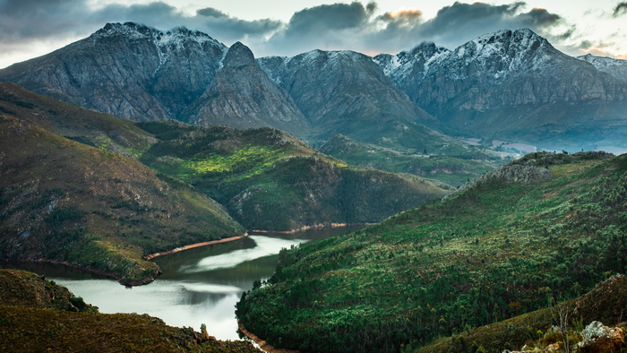Lake and mountains in South Africa under cloudy sky