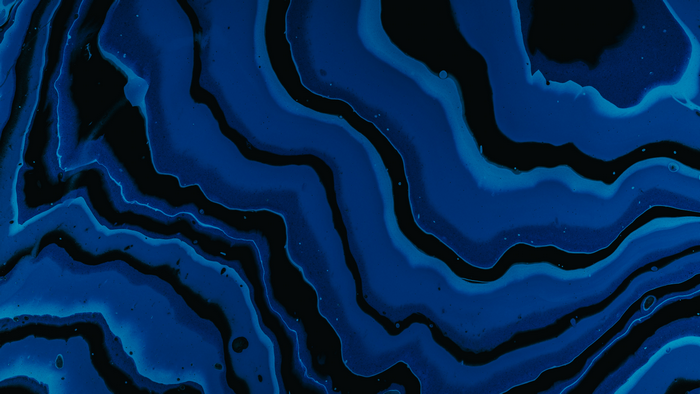 Abstract blue and black liquid paint swirls