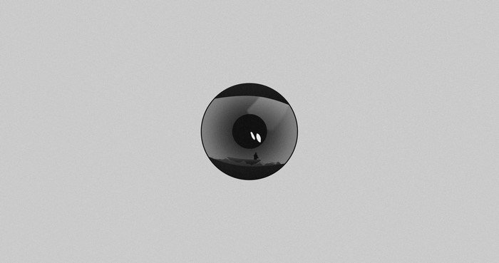 Minimalist eye with a person in a boat