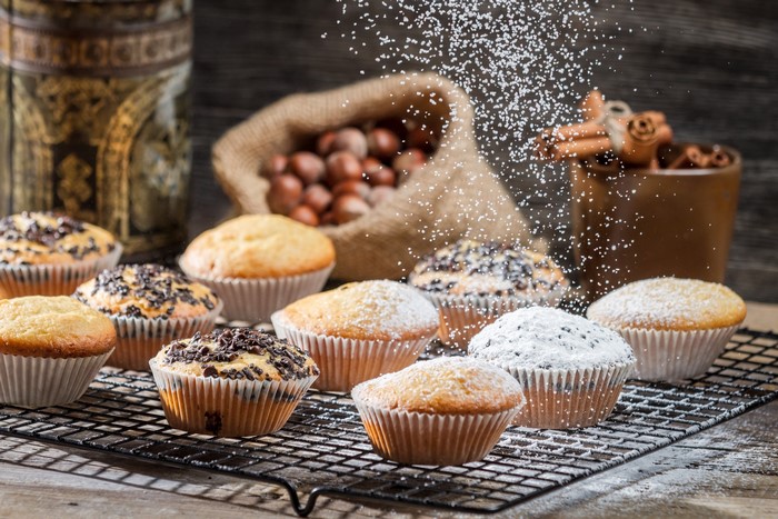 Muffins with powdered sugar and chocolate chips