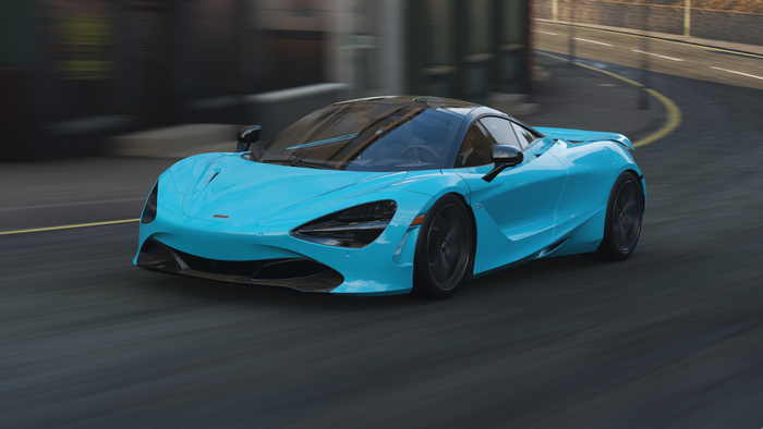 Blue McLaren 720S driving on a city street