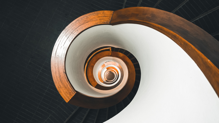 Spiral staircase with wooden handrails