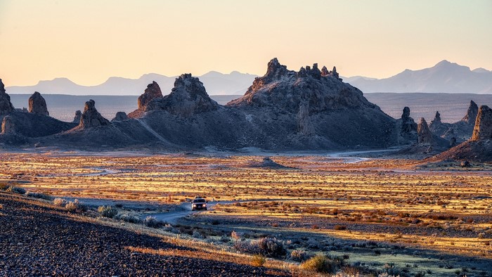 Desert landscape with rock formations and mountains
