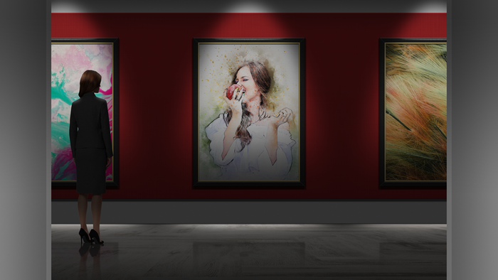 Woman in art gallery looking at paintings