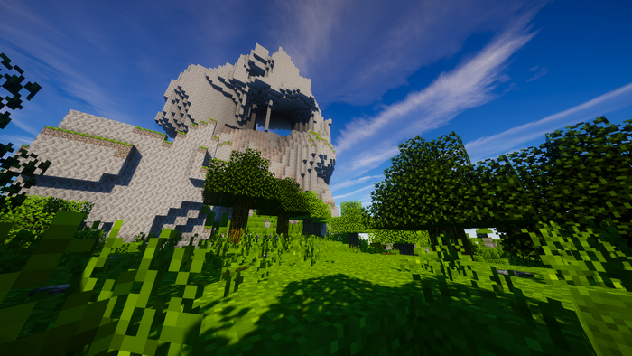 Minecraft landscape with large rock formation and trees