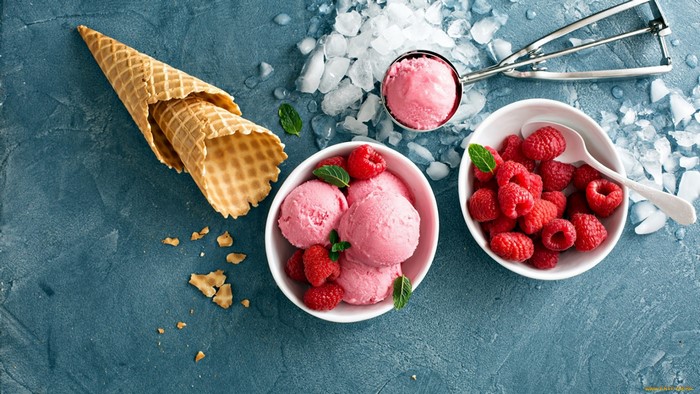 Raspberry ice cream with fresh berries and waffle cones
