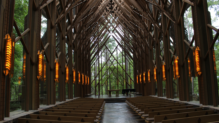 Chapel interior with wooden architecture and pews