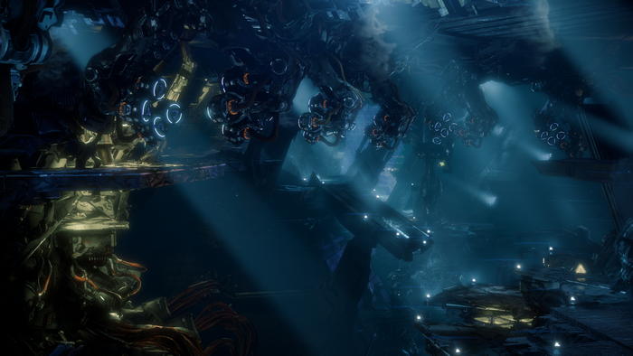 Robotic structures in a dark, misty science fiction environment
