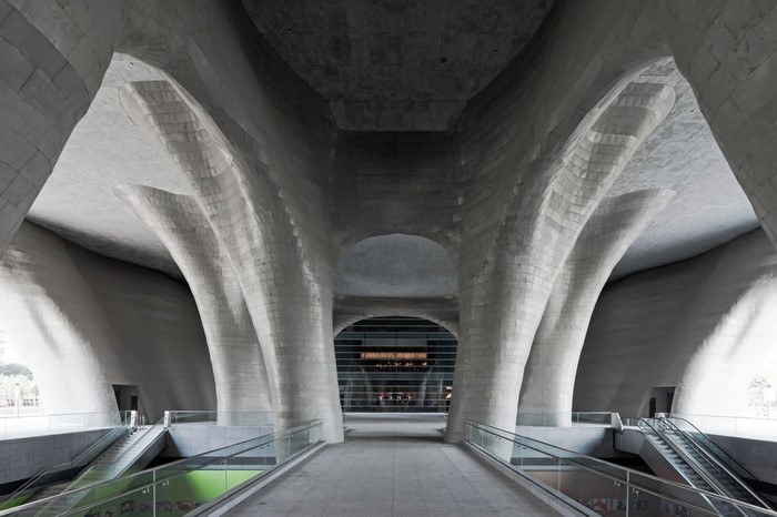 Concrete architecture with escalators and glass railings in Shanghai