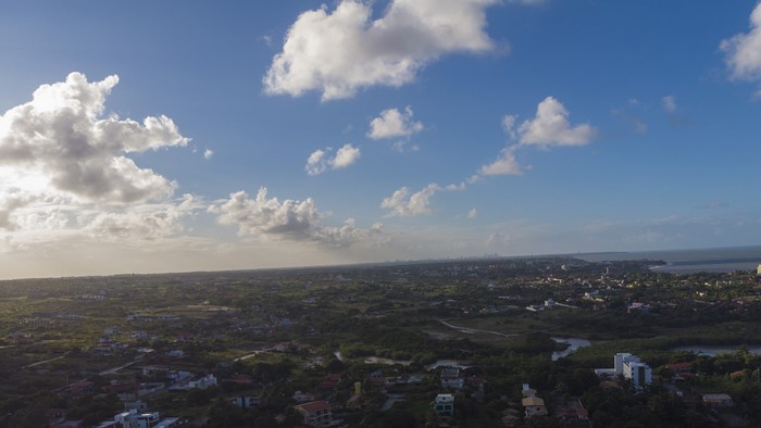 Aerial view of a coastal city in Brazil with clouds