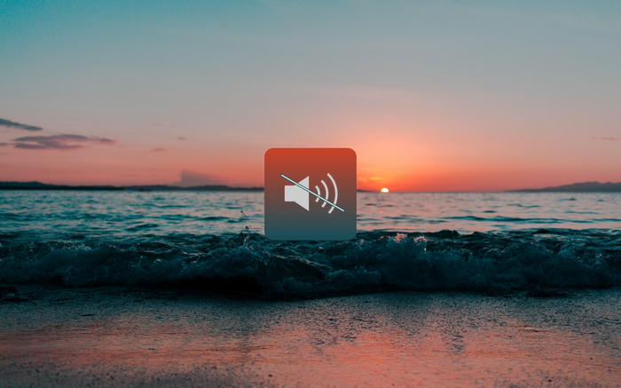Muted speaker icon over a sunset beach
