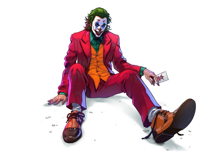 Joker sitting on the floor holding a card