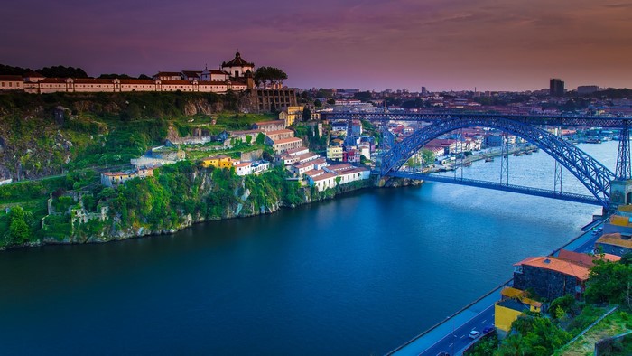 Dom Luís I Bridge over the Douro River in Porto, Portugal at sunset