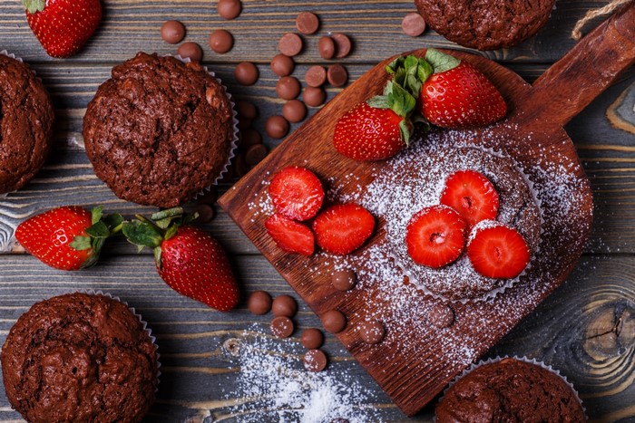 Chocolate muffins with strawberries and chocolate chips