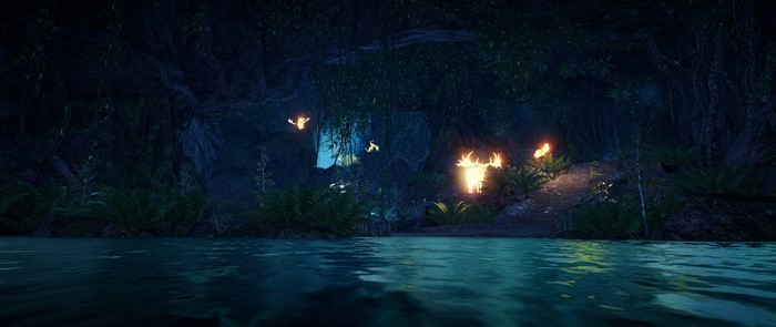 Far Cry Primal cave with glowing creatures and torches