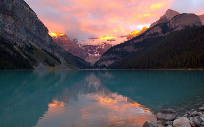 Lake Louise at sunset with mountains and reflection