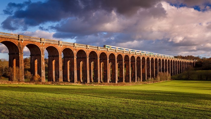 Ouse Valley Viaduct, Sussex, England with train