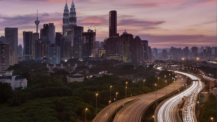 Kuala Lumpur cityscape with Petronas Towers at sunset